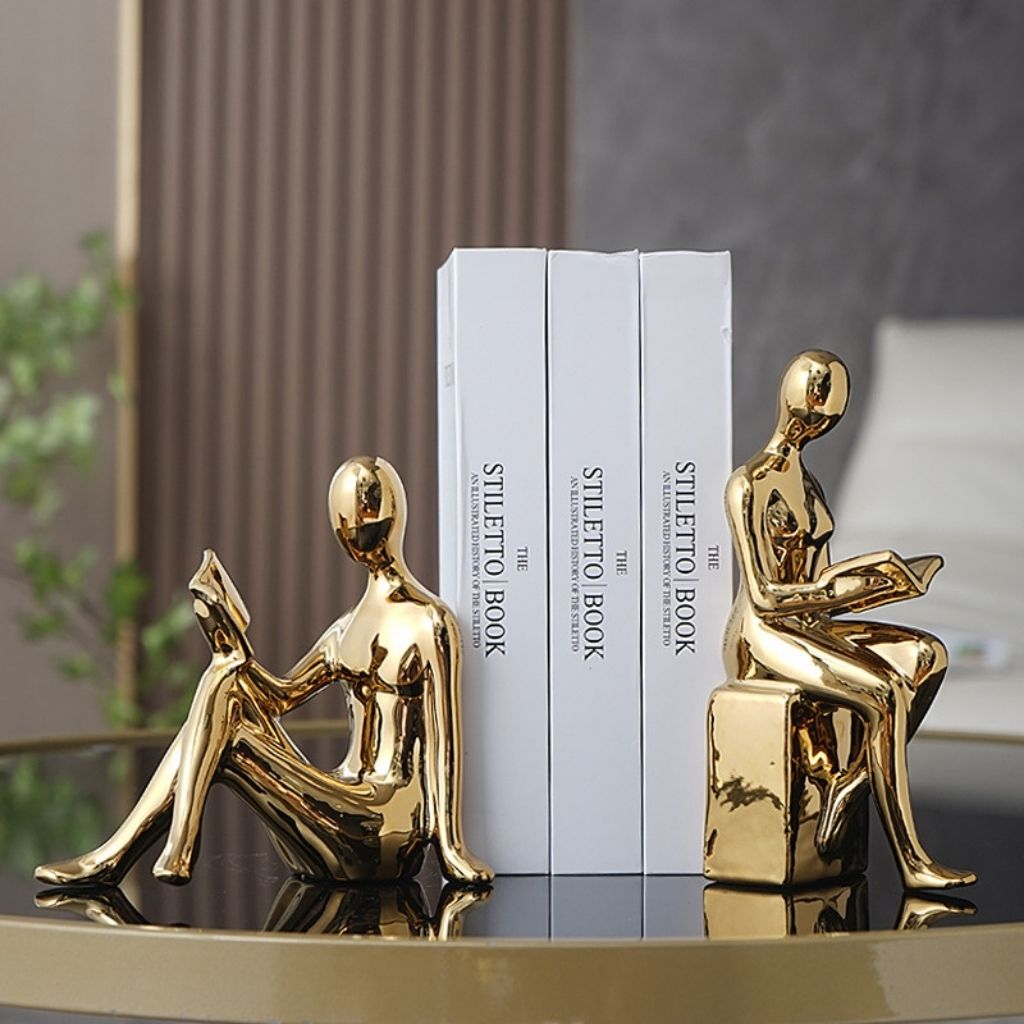 Set van 2 sculpturale keramische boekensteunen met abstracte leesfiguren