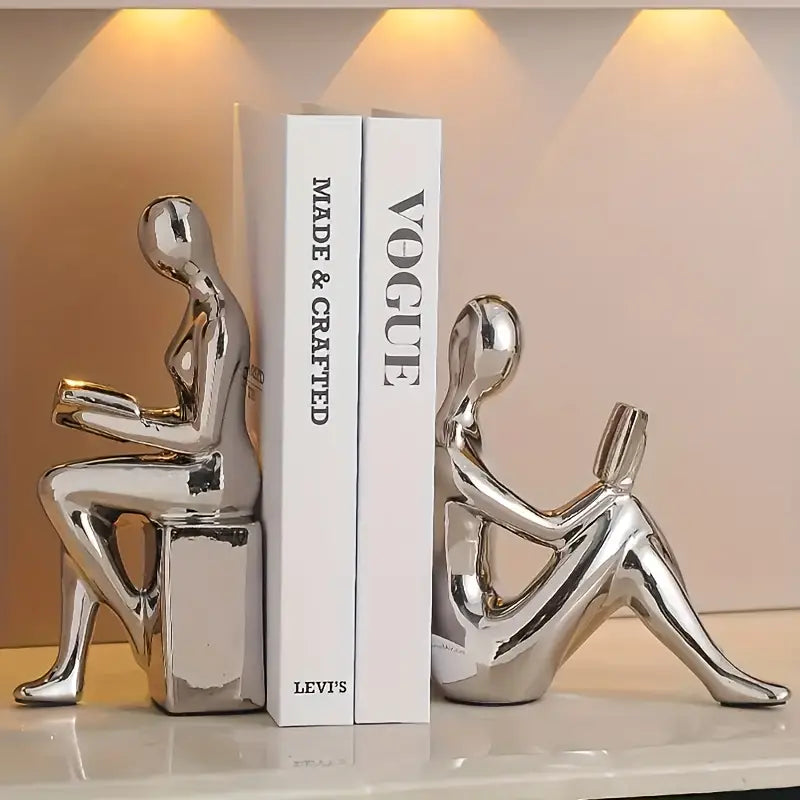 Abstrakte statuer af siddende figurer med blank keramisk finish