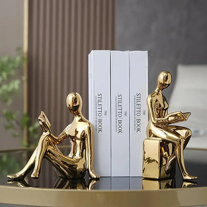 Abstrakte statuer af siddende figurer med blank keramisk finish