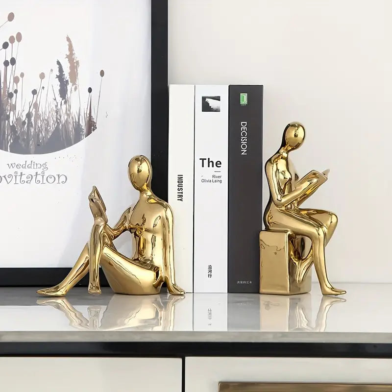 Abstrakte statuer af siddende figurer med blank keramisk finish