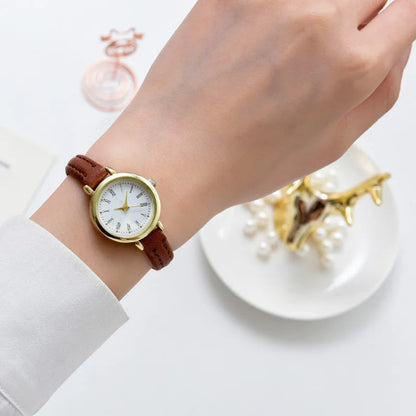 Billie Elegante goldene Damenuhr mit römischem Zifferblatt
