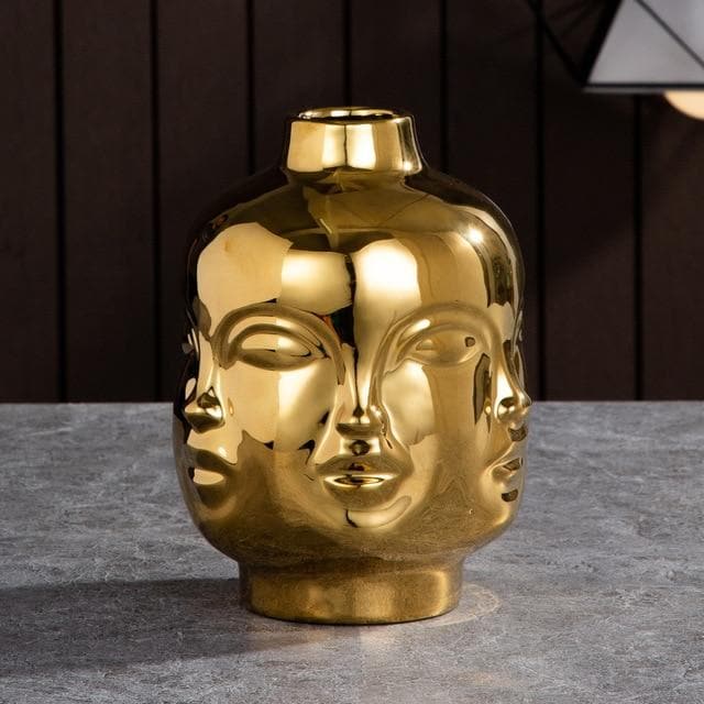 Keramische sculpturale vazen en plantenpotten met artistieke, op gezichten geïnspireerde ontwerpen