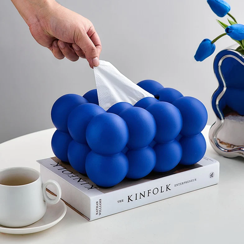 Servietboks i keramik med legende kugleformet design