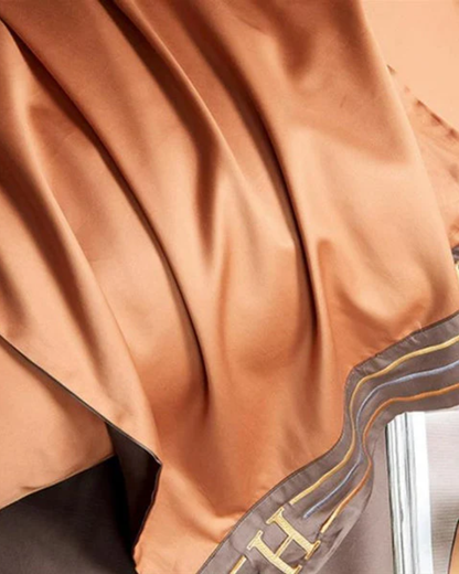 Sengetøjssæt i bomuldssatin med elegant broderi