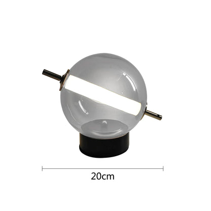 Elegant bordlampe med kugleformet matteret glasskærm og metalfod