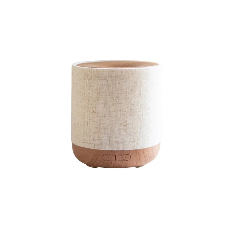 Aromatherapieverspreider van stof met verlichting en bevochtiging