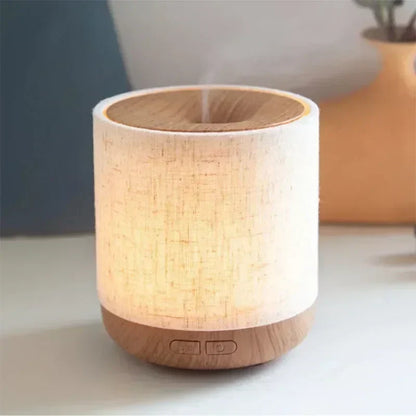 Aromatherapieverspreider van stof met verlichting en bevochtiging