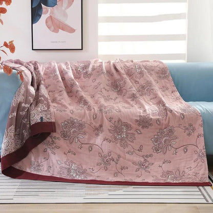 Femlaget tæppe i bomuldsgaze med jacquardblomstermønster