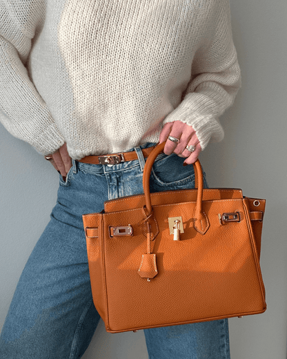 Lederhandtasche für Damen mit verstellbarem Riemen und geräumigem Design  