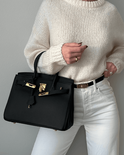 Lederhandtasche für Damen mit verstellbarem Riemen und geräumigem Design  
