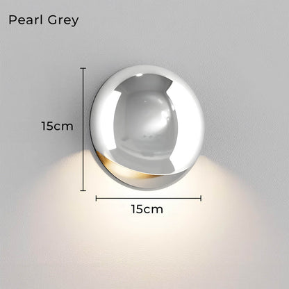 Minimalistische, von Kieselsteinen inspirierte LED-Wandleuchte mit warmweißem Licht