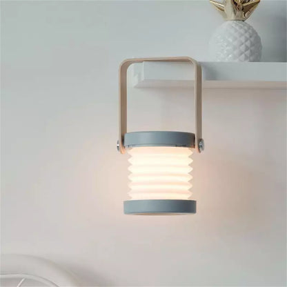 Tragbare dimmbare LED-Tischlampe mit klappbarem Design
