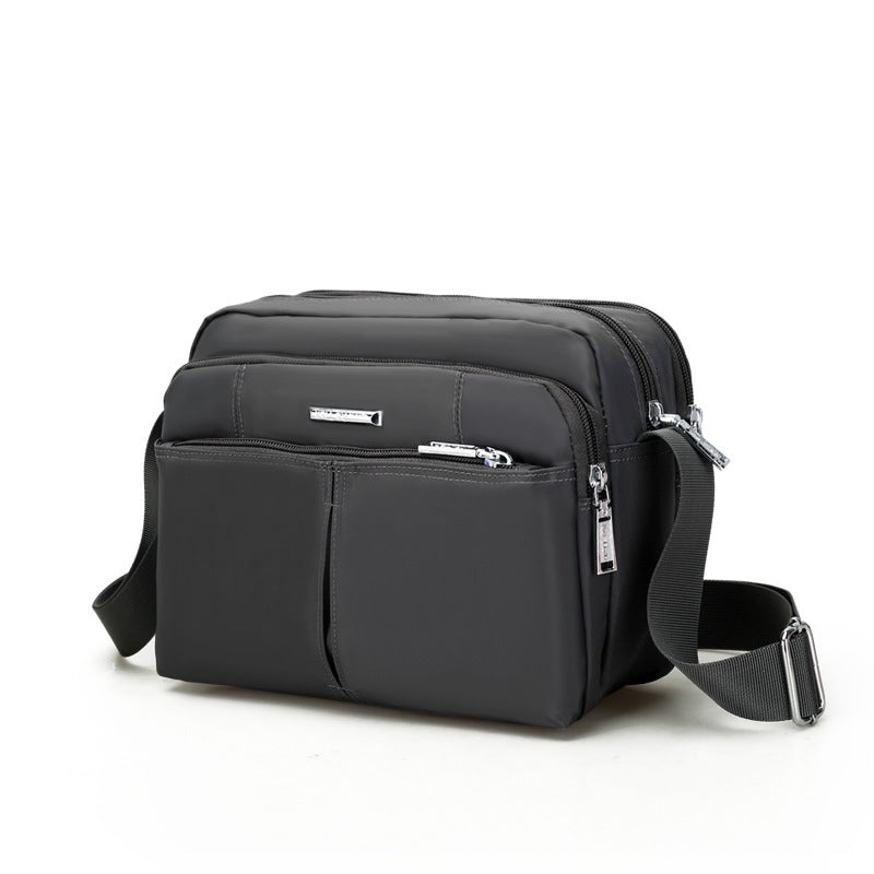 Waterdichte multi-pocket messenger tas met verstelbare schouderband