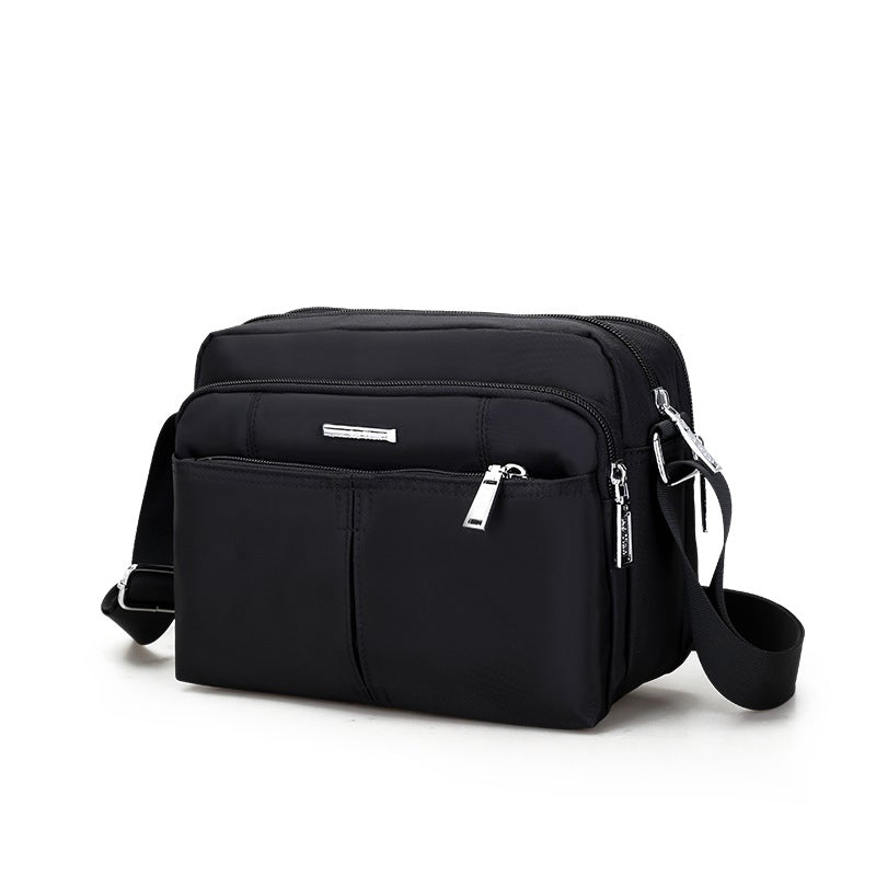 Waterdichte multi-pocket messenger tas met verstelbare schouderband