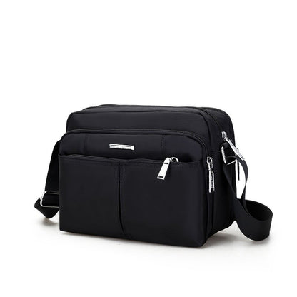 Waterdichte multi-pocket messenger tas met verstelbare schouderband
