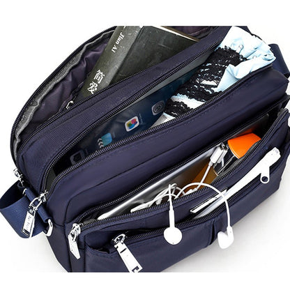 Waterdichte multi-pocket messenger tas met verstelbare schouderband